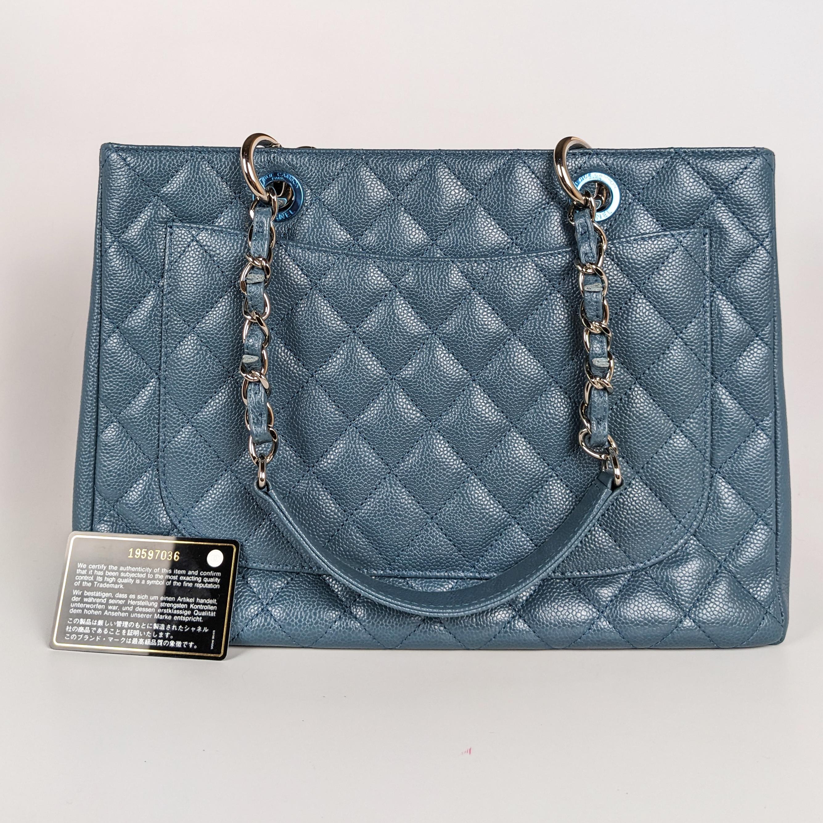 Chanel Caviar Leather Grand Shopping Tote GST Blue

Condition: This authentic Chanel tote is in excellent pre-loved condition. There is faint corner wear and light interior marks.

Includes: Authenticity card

Features: Silver-tone hardware,
