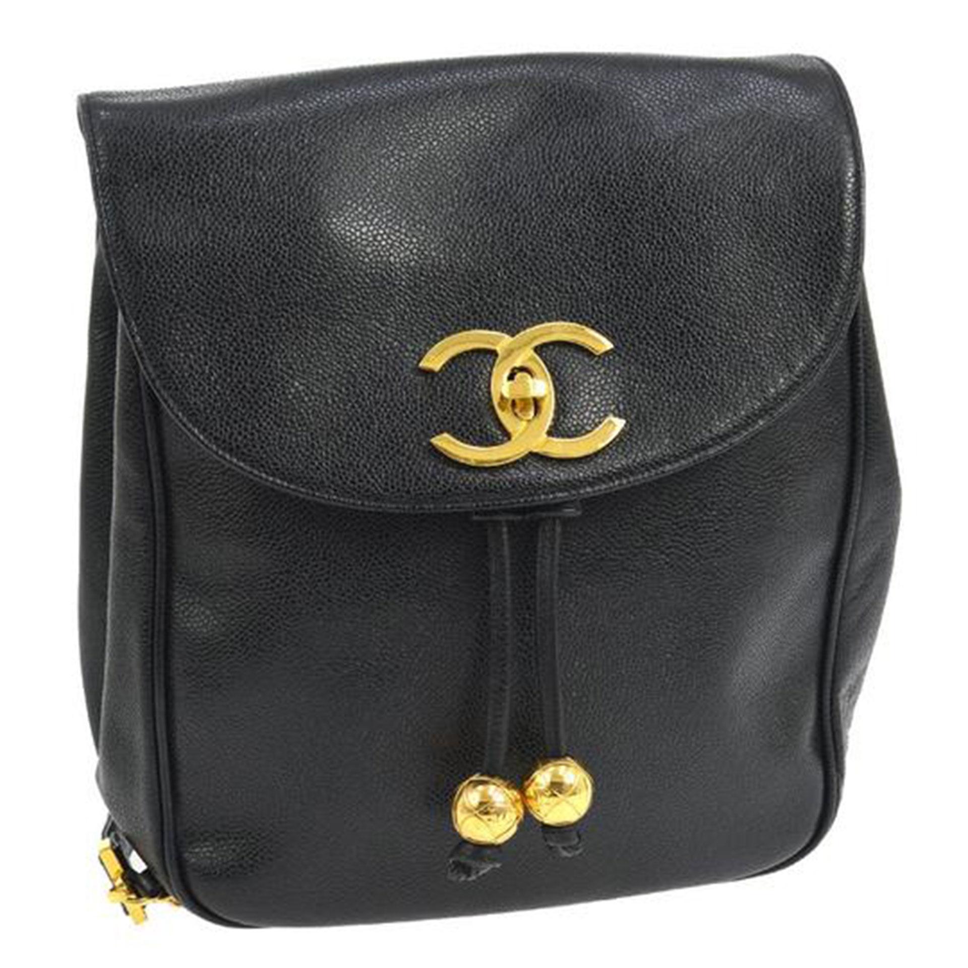 Chanel Black Caviar Backpack Vintage 2 Pocket Ball Charm CC Logo

Chanel Black Caviar Backpack with golden ball charms.
 This chic vintage Chanel backpack is ideal for everyday style about town. From 1990's. 
Straps measure 30