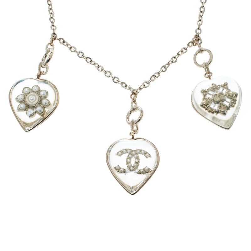 Contemporary Chanel CC Aged Gold Tone Metal Motif Embedded Resin Heart Pendants Necklace