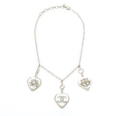 Chanel CC Aged Gold Tone Metal Motif Embedded Resin Heart Pendants Necklace