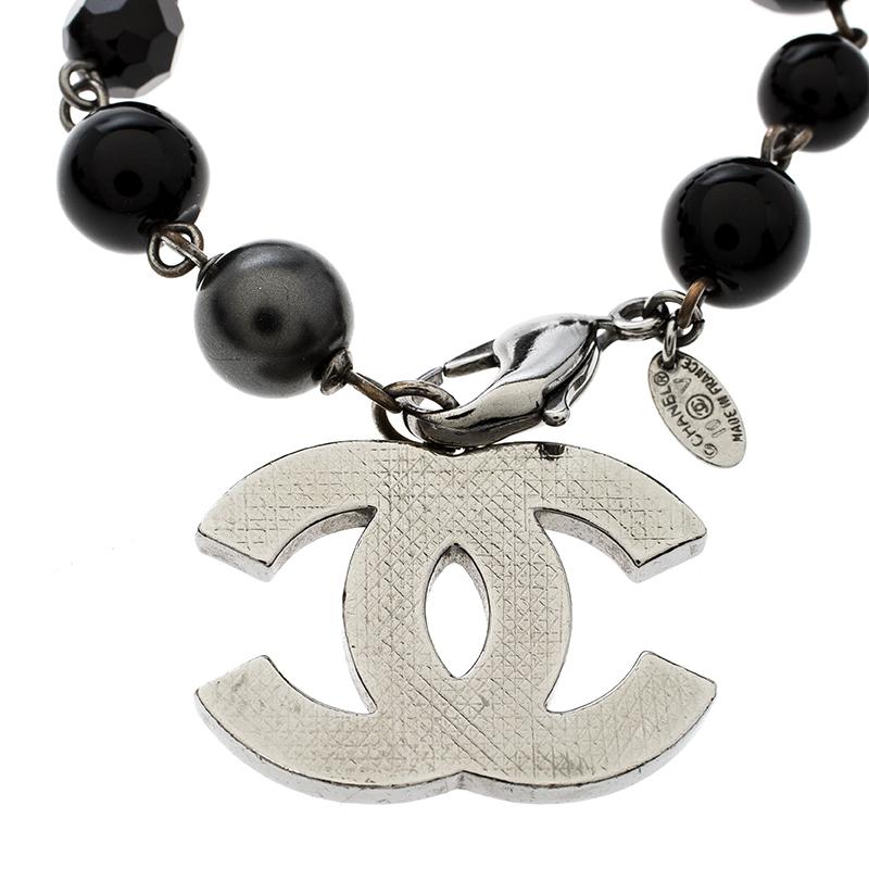 Chanel has designed the most artistic bracelet with the dark beads featuring different texture over it and CC metal charm. It will give you a smart look when you wear it with any of the casual outfits. The simple locking system is very easy to close