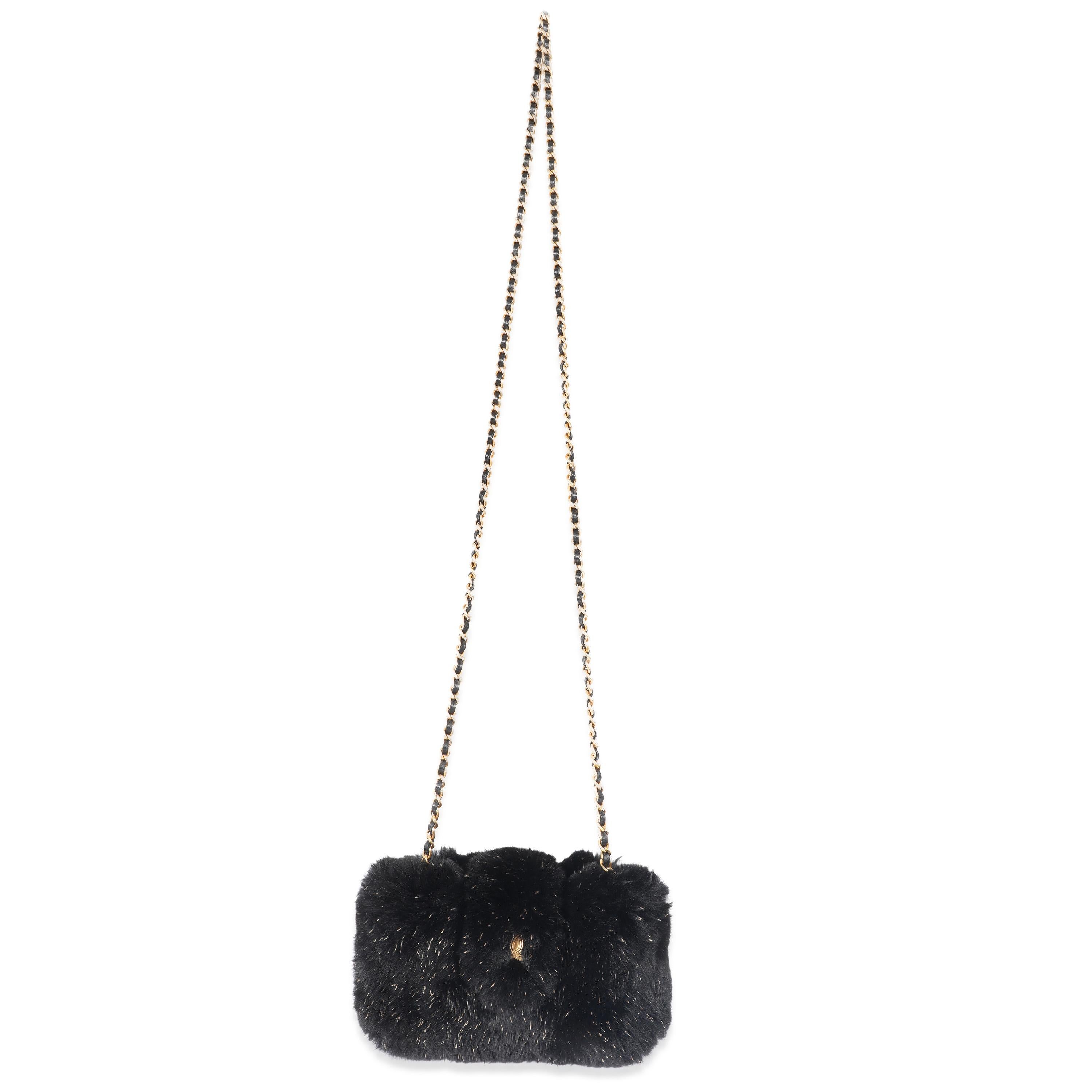 Listing Title: Chanel CC Black Fur Chain Clutch
SKU: 129017
Condition: Pre-owned 
Handbag Condition: Very Good
Condition Comments: Very Good Condition. Scratching and light tarnishing to hardware. Light discoloration to lining.
Brand: Chanel
Model: