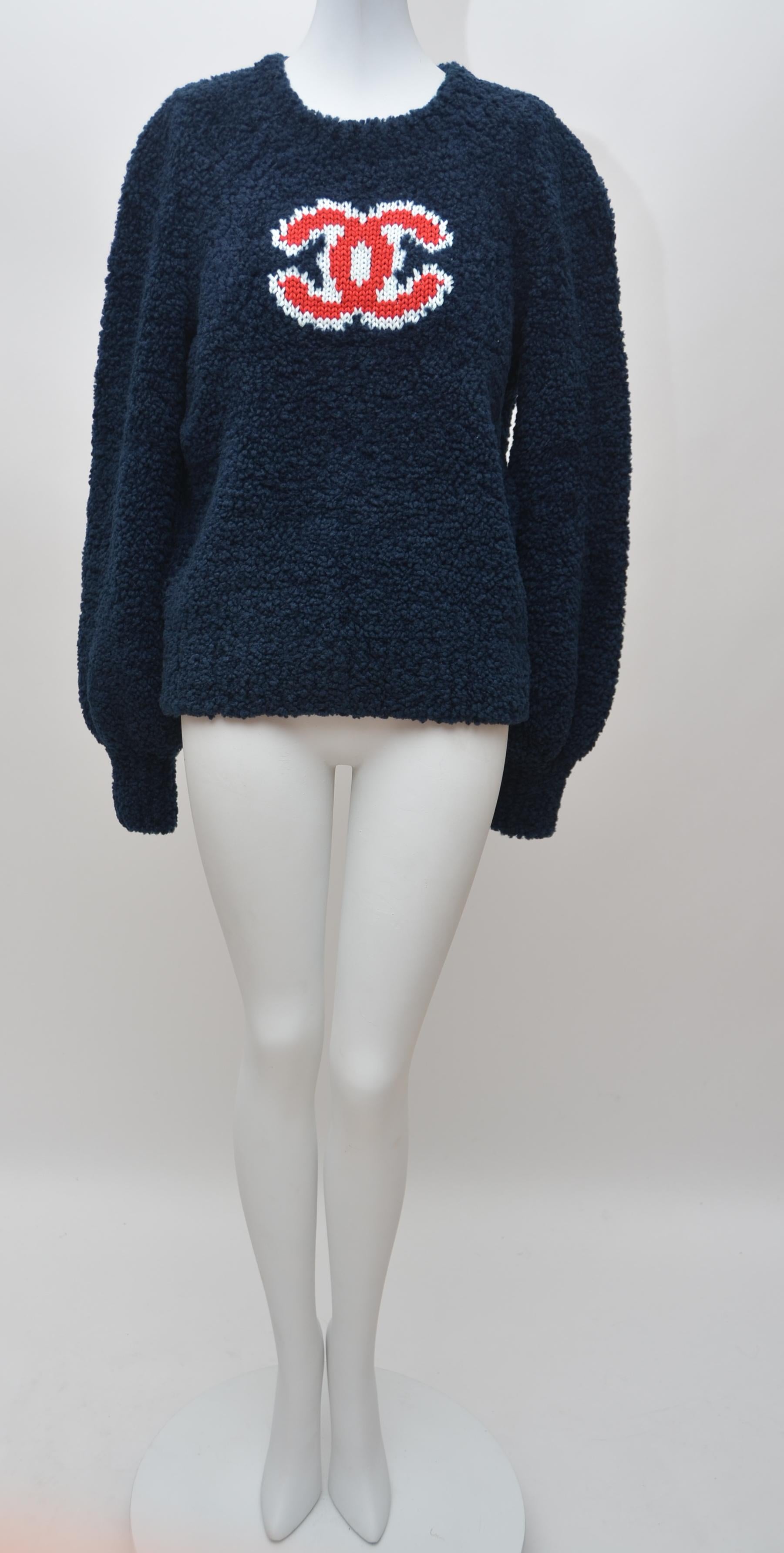 100% AUTHENTIC GUARANTEED Chanel teddy sweater in blue 
Due to flashlight color tone might vary in person.
New with tags.
Receipt available to purchaser upon request
Size 38FR.
Please familiarize yourself with this particular Chanel sizing before
