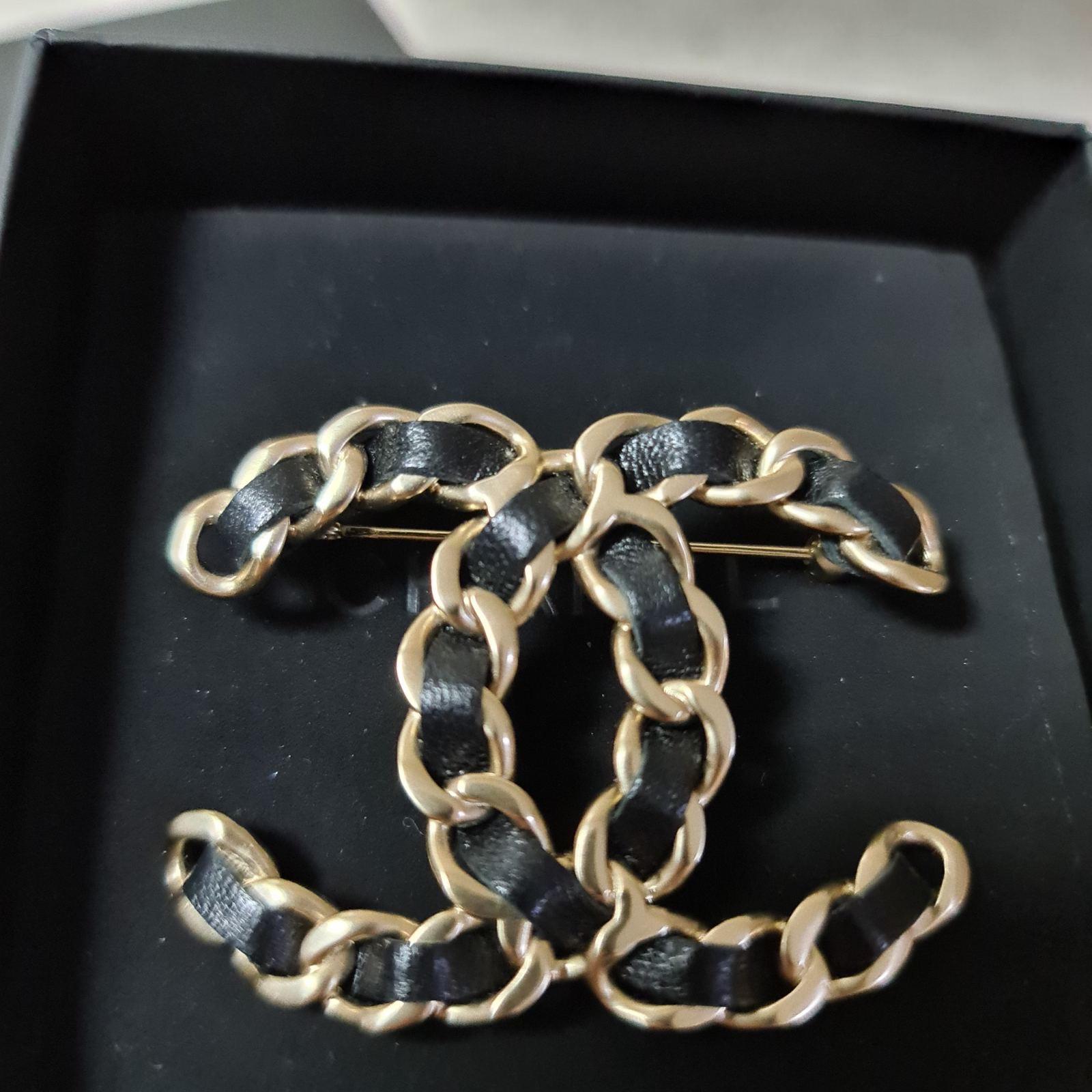 chanel brooch leather