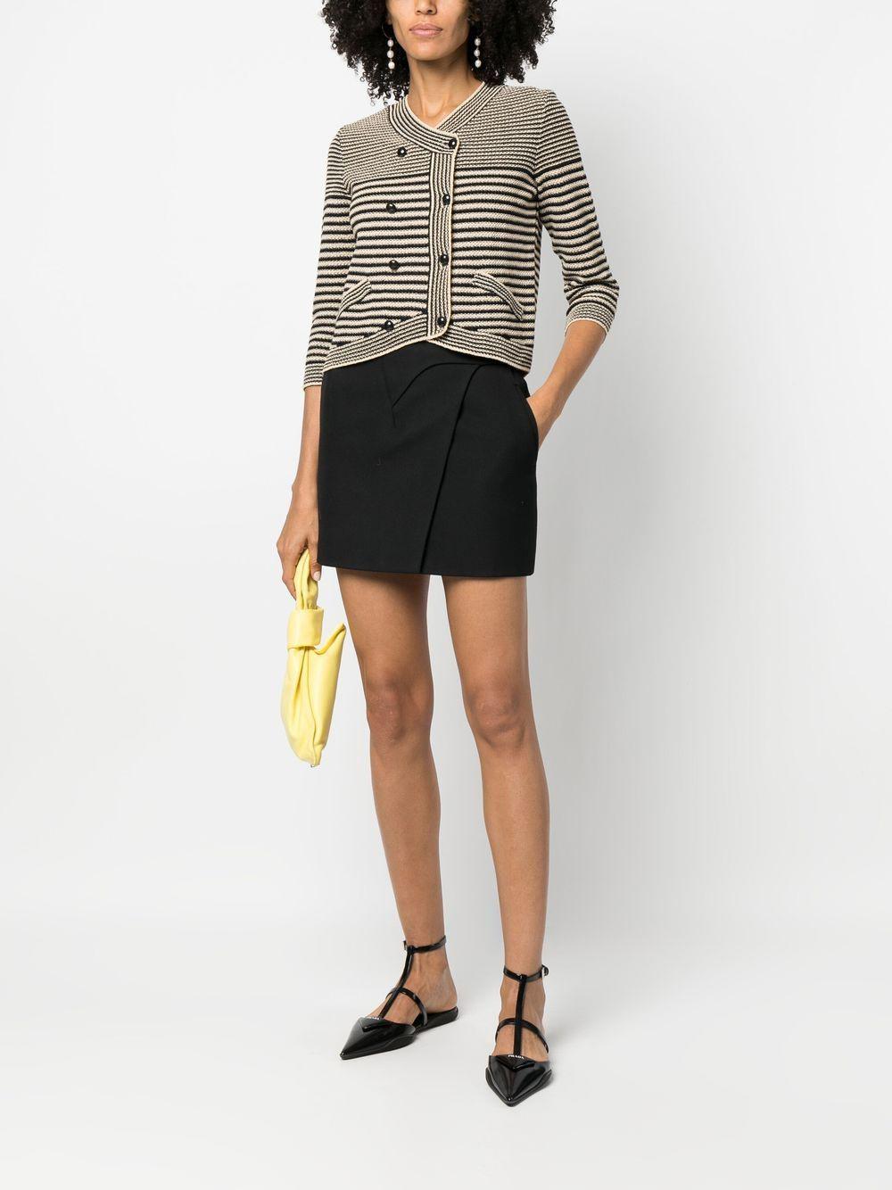 Charming Chanel maritime knit jacket with double rows of CC logo buttons.
Size mark 34 FR. Condition is pristine, kept unworn.