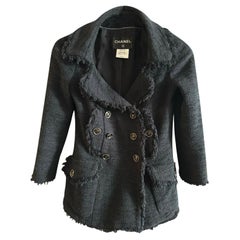 Chanel - Veste en tweed noir Timeless à boutons CC