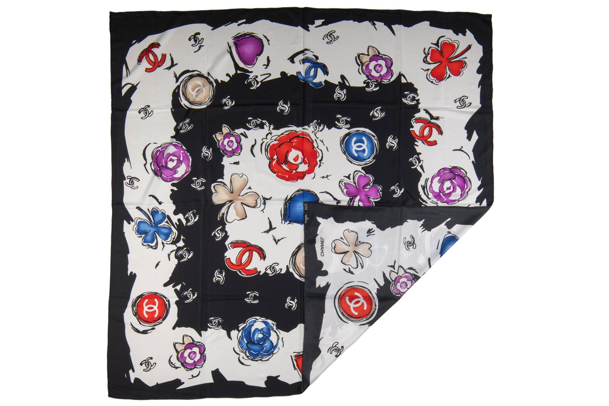 This Chanel CC Camellia Clover Heart Scarf features 100% silk and is a stunning graphic design of bright camellias and clovers with Chanel CC logos.