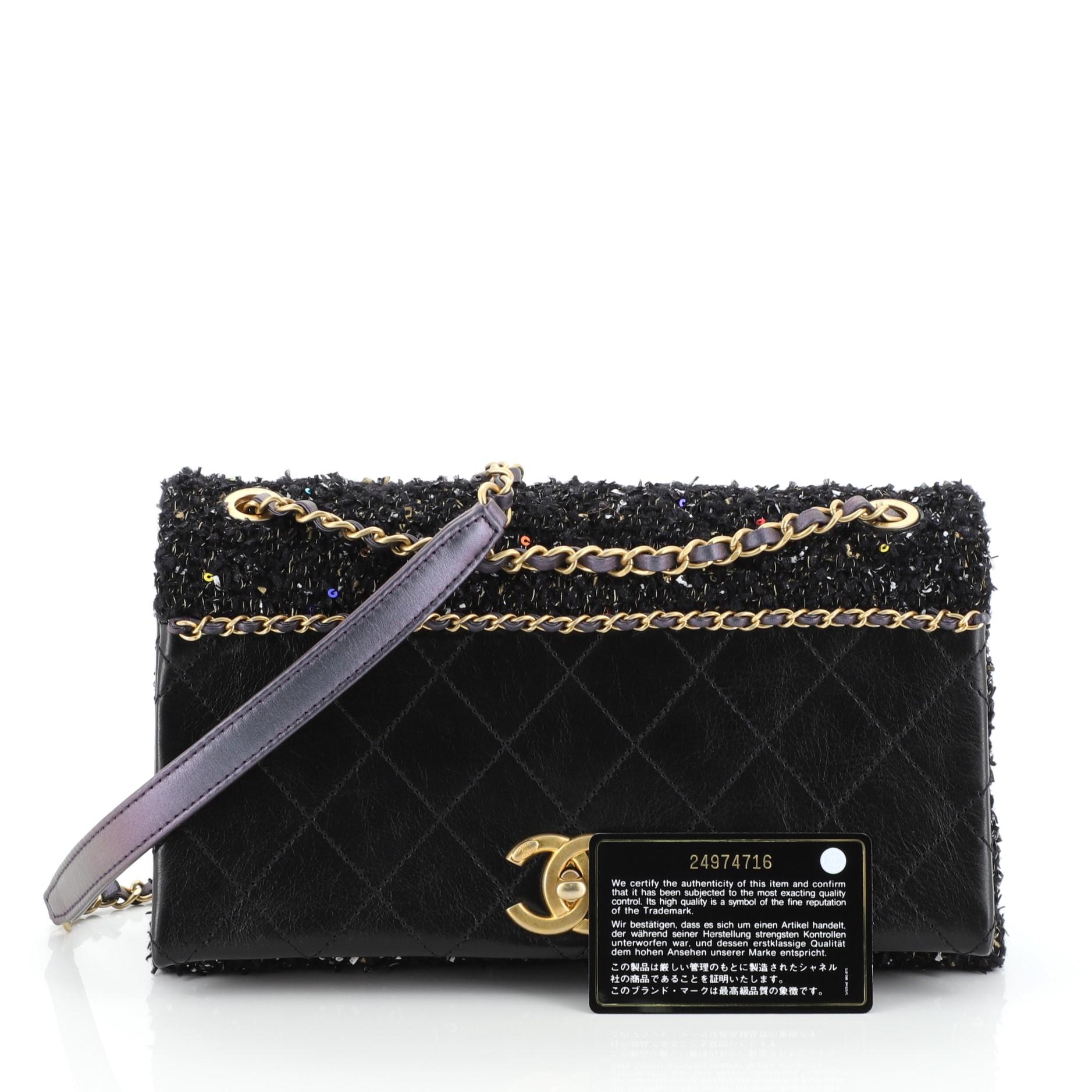 This Chanel CC Chain Flap Bag Quilted Embellished Tweed and Quilted Calfskin Small, crafted from black tweed and quilted calfskin leather, features woven-in leather chain strap and gold-tone hardware. Its CC turn-lock closure opens to a pink fabric