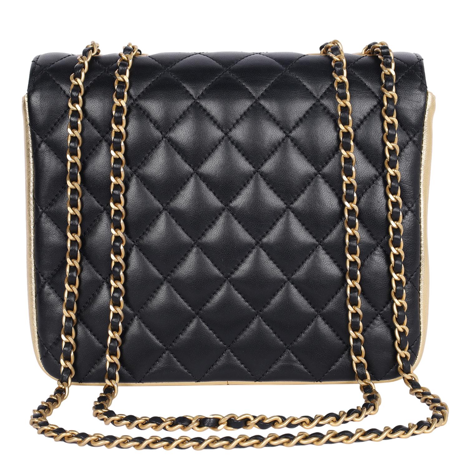 Authentic, pre-loved Chanel black double flap quilted lambskin leather shoulder cross body bag. Features quilted leather with gold accent leather, gold CC hardware, a long gold chain strap with leather insert, front clasp CC closure. The interior