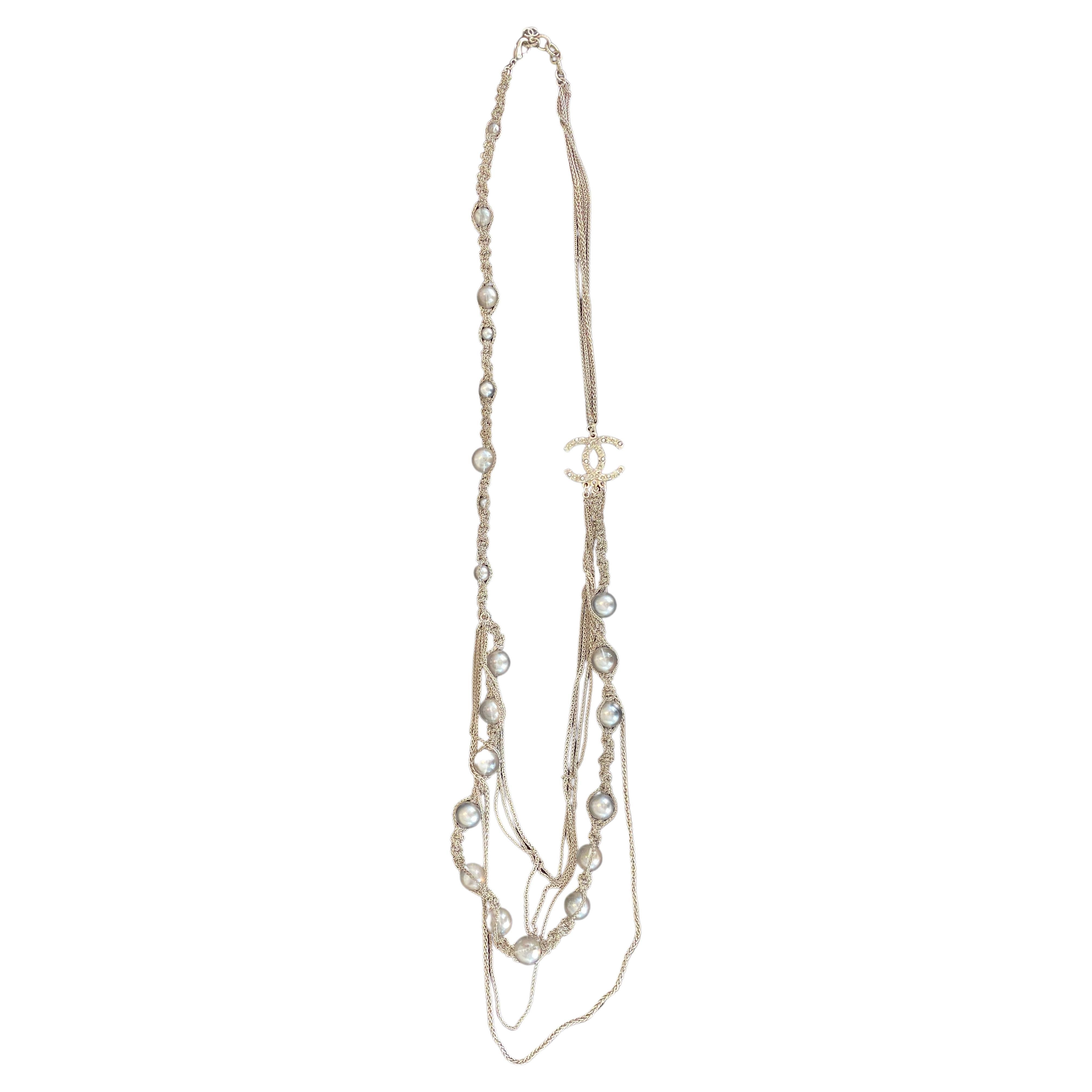 Model: CC Choker Necklace Metal with Faux Tahiti Pearls and Beads. 
The color of the chain looks like in the photo where it is worn
51cm half length
102cm total length
Condition: Good.  
Accessories: original box
Designer: Chanel
Exterior Color: