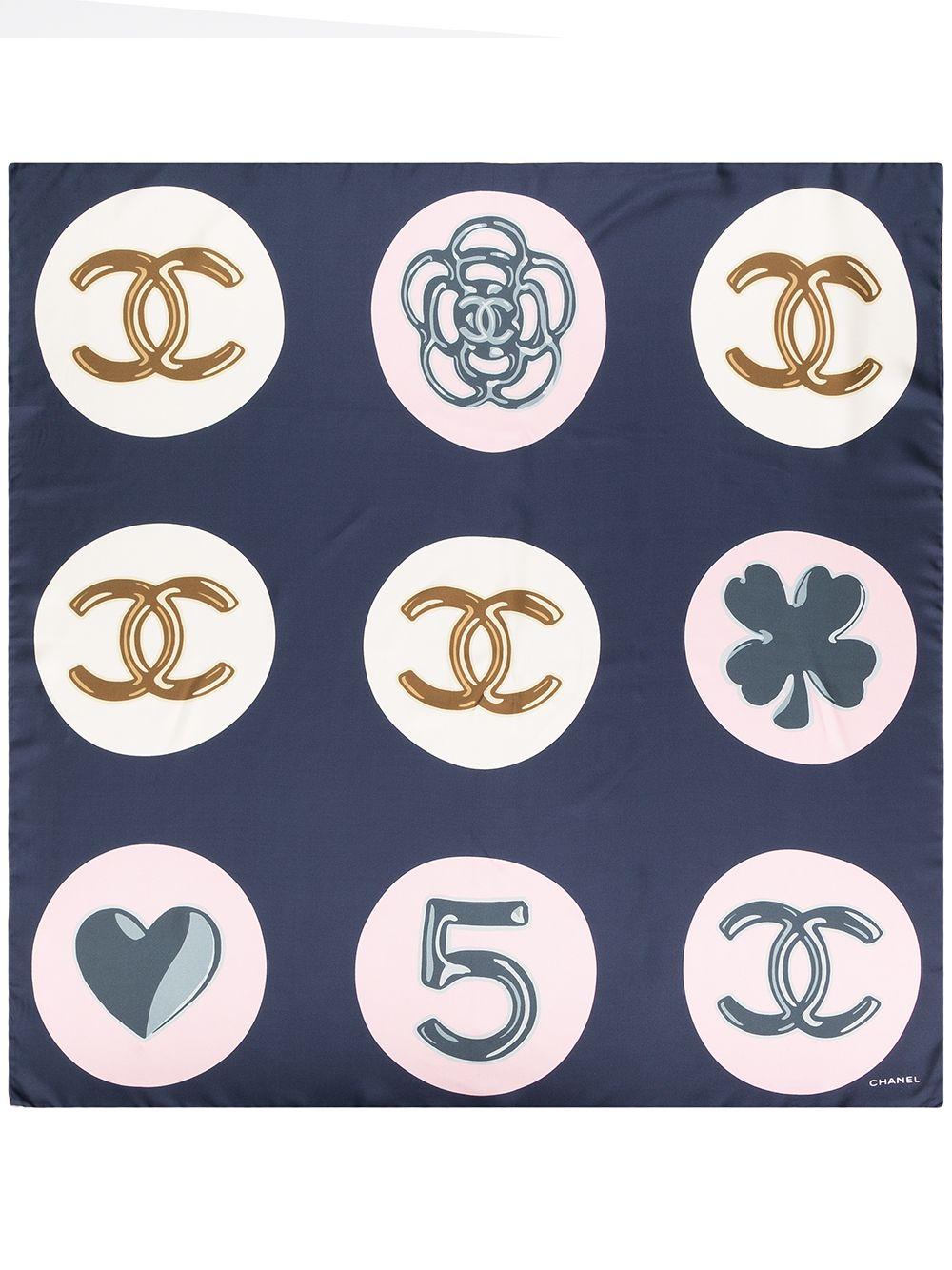 Camellia flowers, four-leaf clovers and the iconic interlocking CC logo make up this gorgeous 100% silk scarf from Chanel. In royal navy and blush pink, this scarf would add the perfect finishing touch to any ensemble or can be loosely tied on your