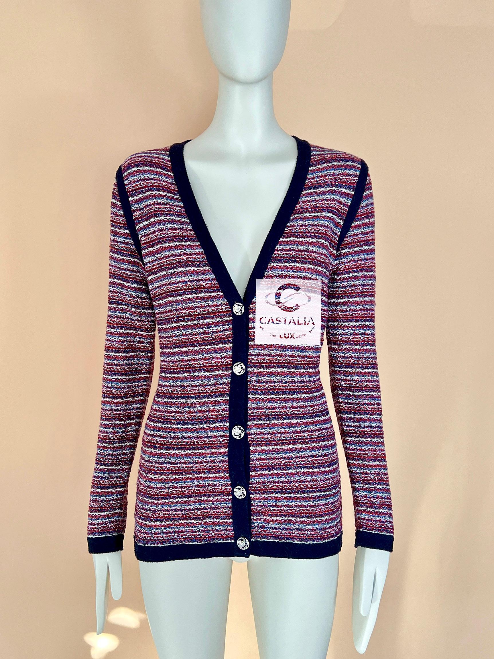 Collectors Chanel woven tweed cardigan with charming CC logo Clover buttons. 
Size mark 36 FR. Condition is pristine