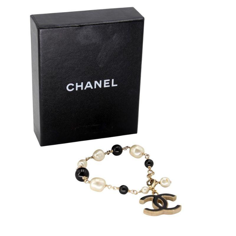 Chanel CC Coco Charm Mother Of Peals Gold W/Bracelet CC-0817N-0003

Chanel Mother of Pearl bracelet with big CC monogram charm bracelet hand made in France with elegant detail simply breathe taking. This is a must have piece for any avid Chanel