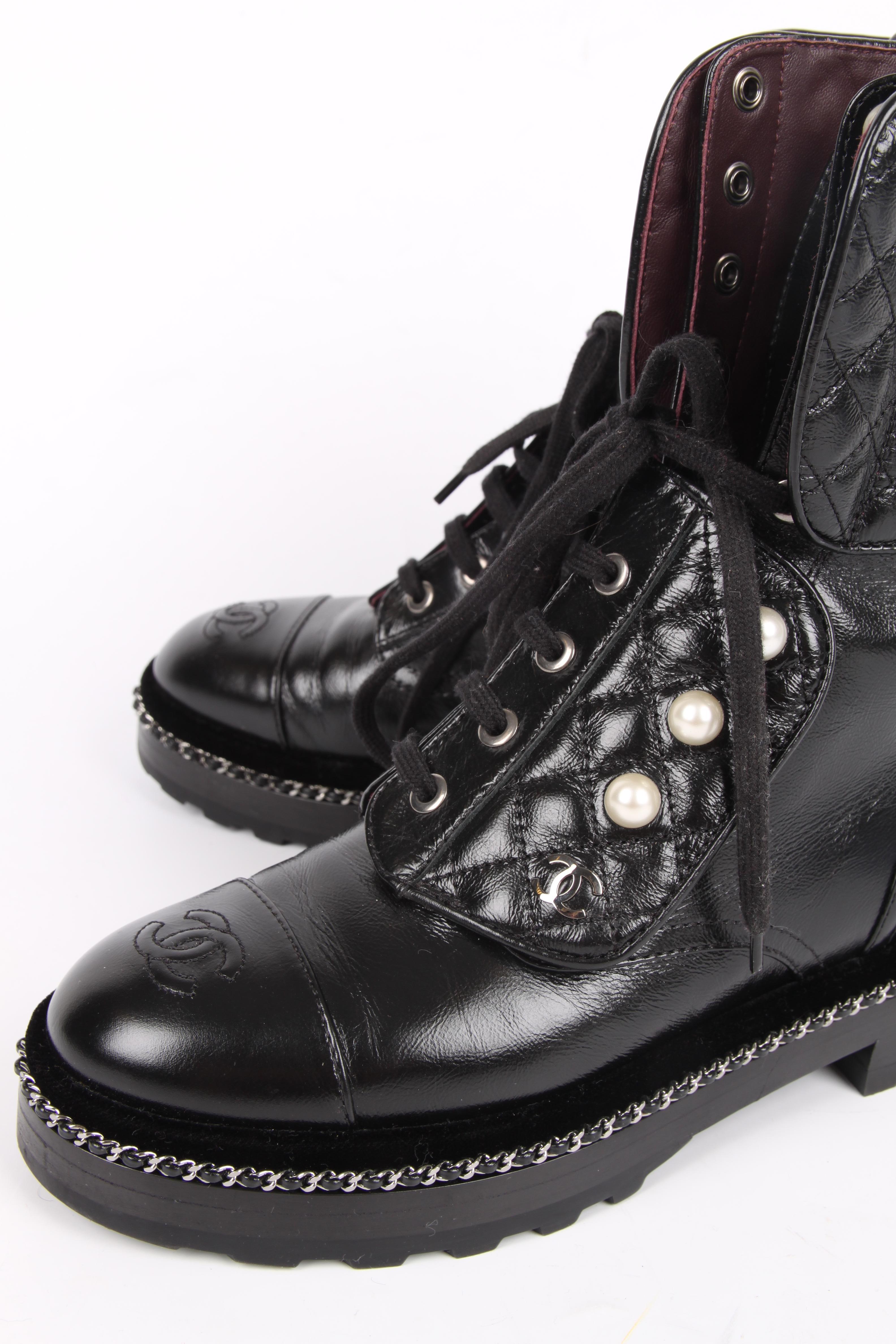 Superfancy Combat Boots by Chanel, these are like new!

A round toe with and embroidered CC logo, a sturdy rubber outsole with a silver-tone chain and velvet trim right above it.

Lace-up closure with quilted patches embellished with faux pearls and