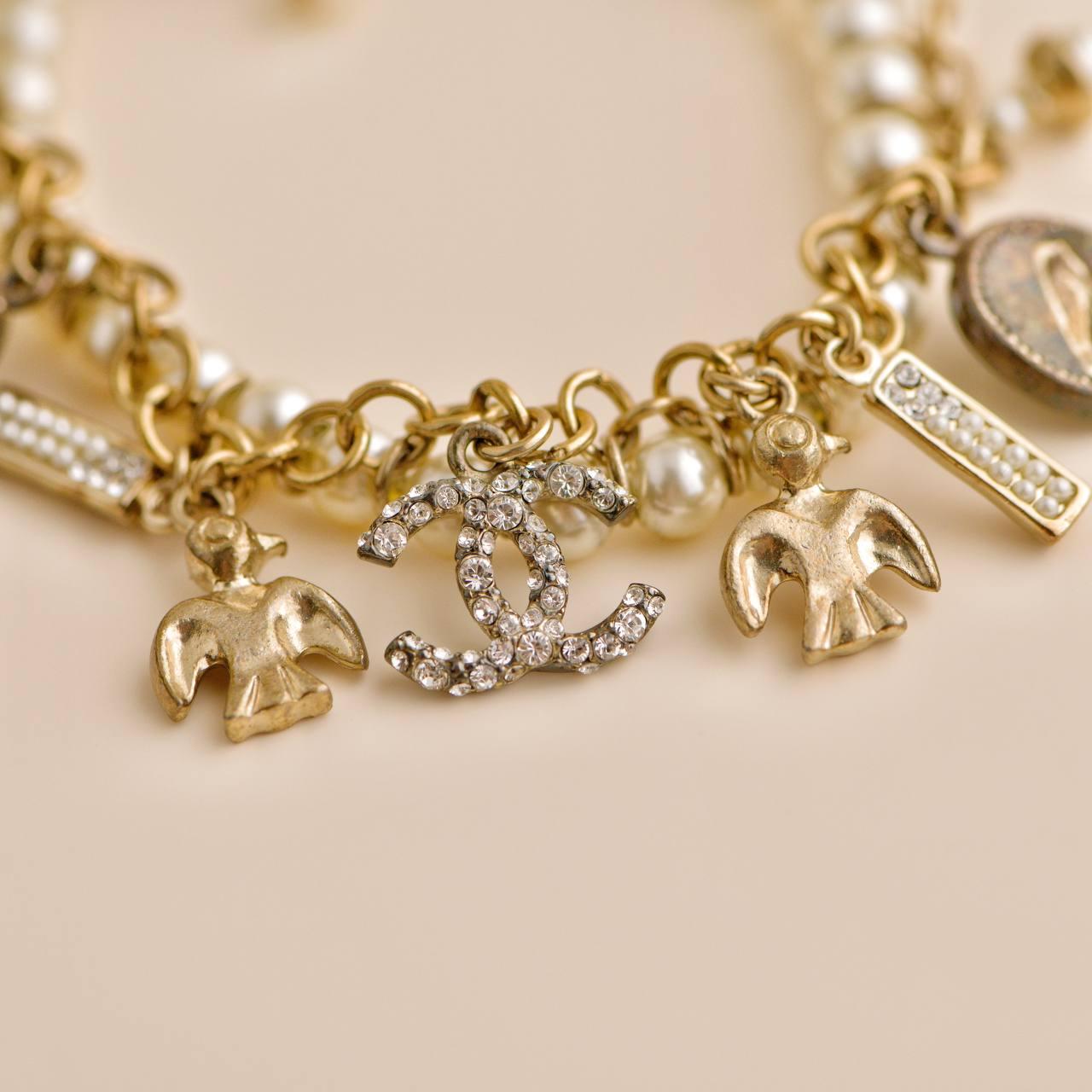 Women's or Men's Chanel CC Crystal Faux Pearl Charm Bracelet For Sale
