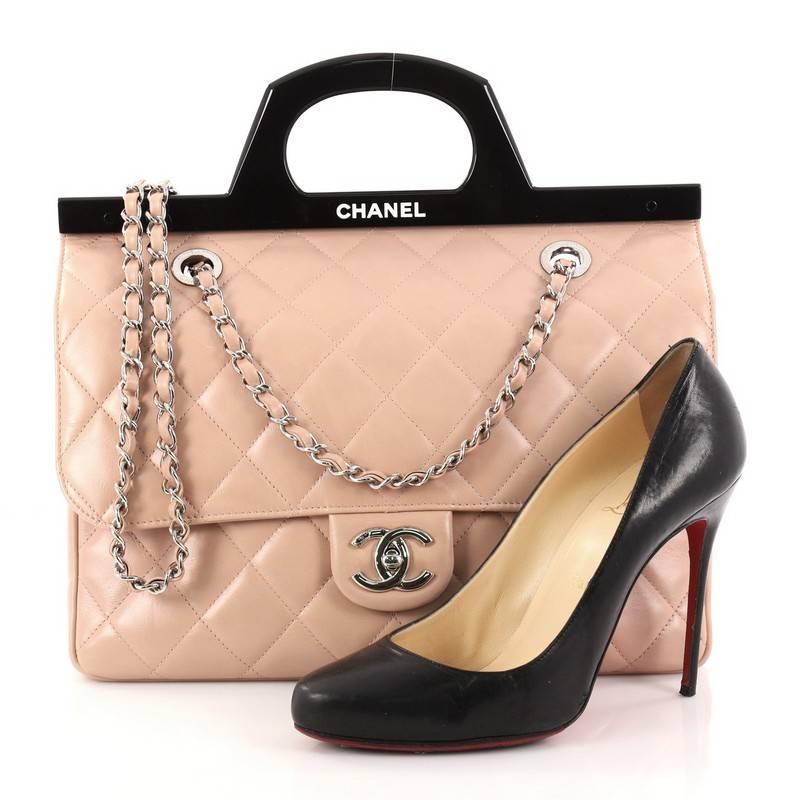 This authentic Chanel CC Delivery Tote Quilted Glazed Calfskin Small presented in the brand's Fall/Winter 2014 Act II Collection mixes classic Chanel styling with a modern, fresh twist. Crafted from pink diamond quilted glazed calfskin, this