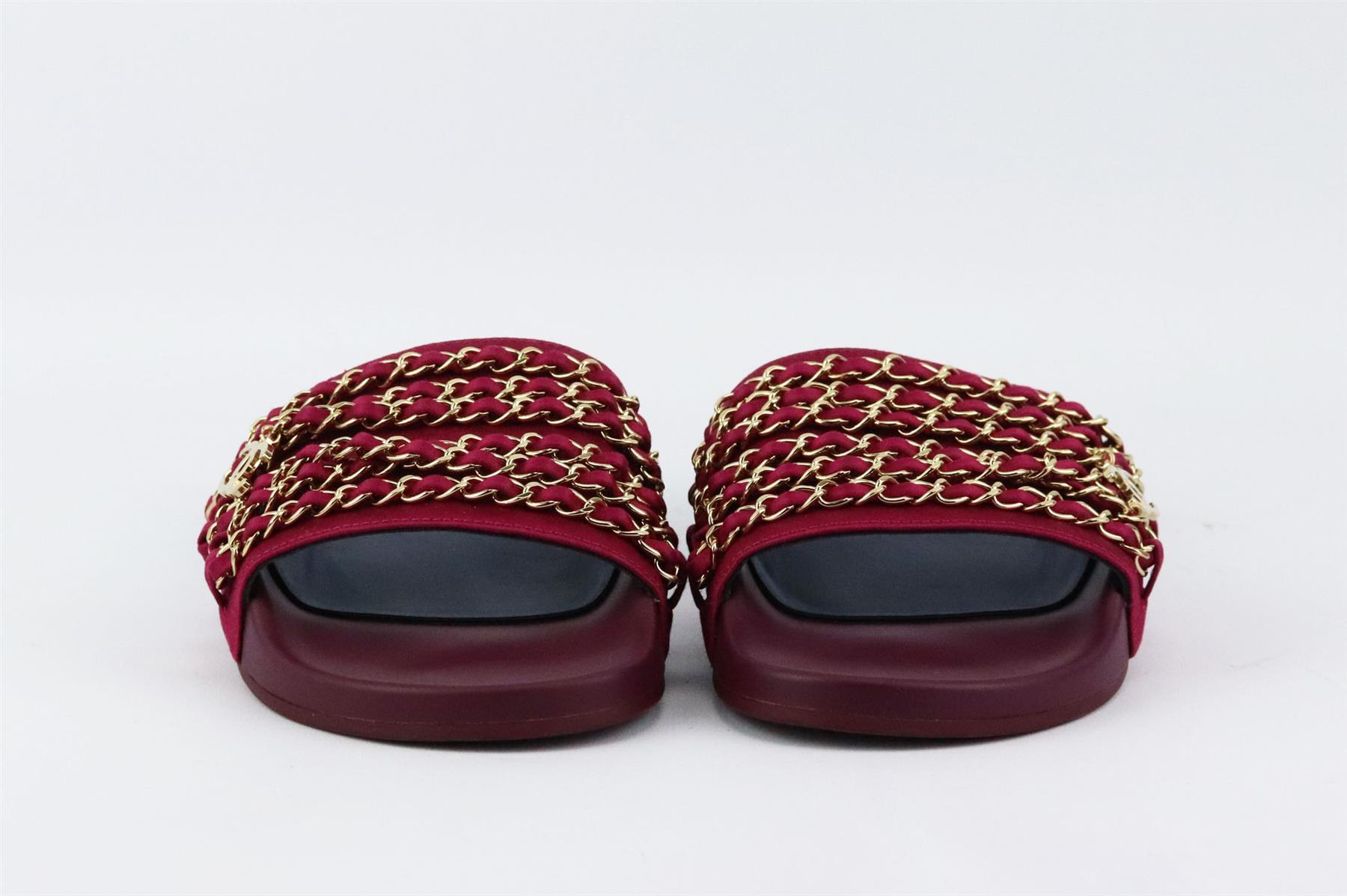 Chanel may specialize in luxurious bags, but the brand also designs great pieces, these slides are made from rich red CC detailed gold-tone chain trimmed satin and has a contoured rubber footbed with gripped soles for comfort and grip. Sole measures