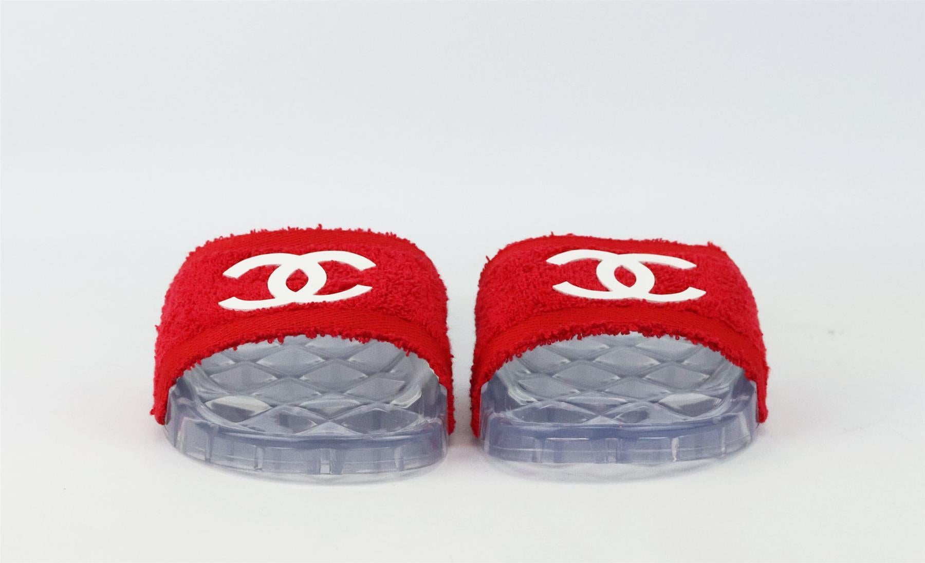 Chanel may specialize in luxurious bags, but the brand also designs great pieces that are suitable for everyday wear, these slides are made from CC white detailed and red terry-cloth with clear quilted rubber soles and has a contoured footbed. Sole