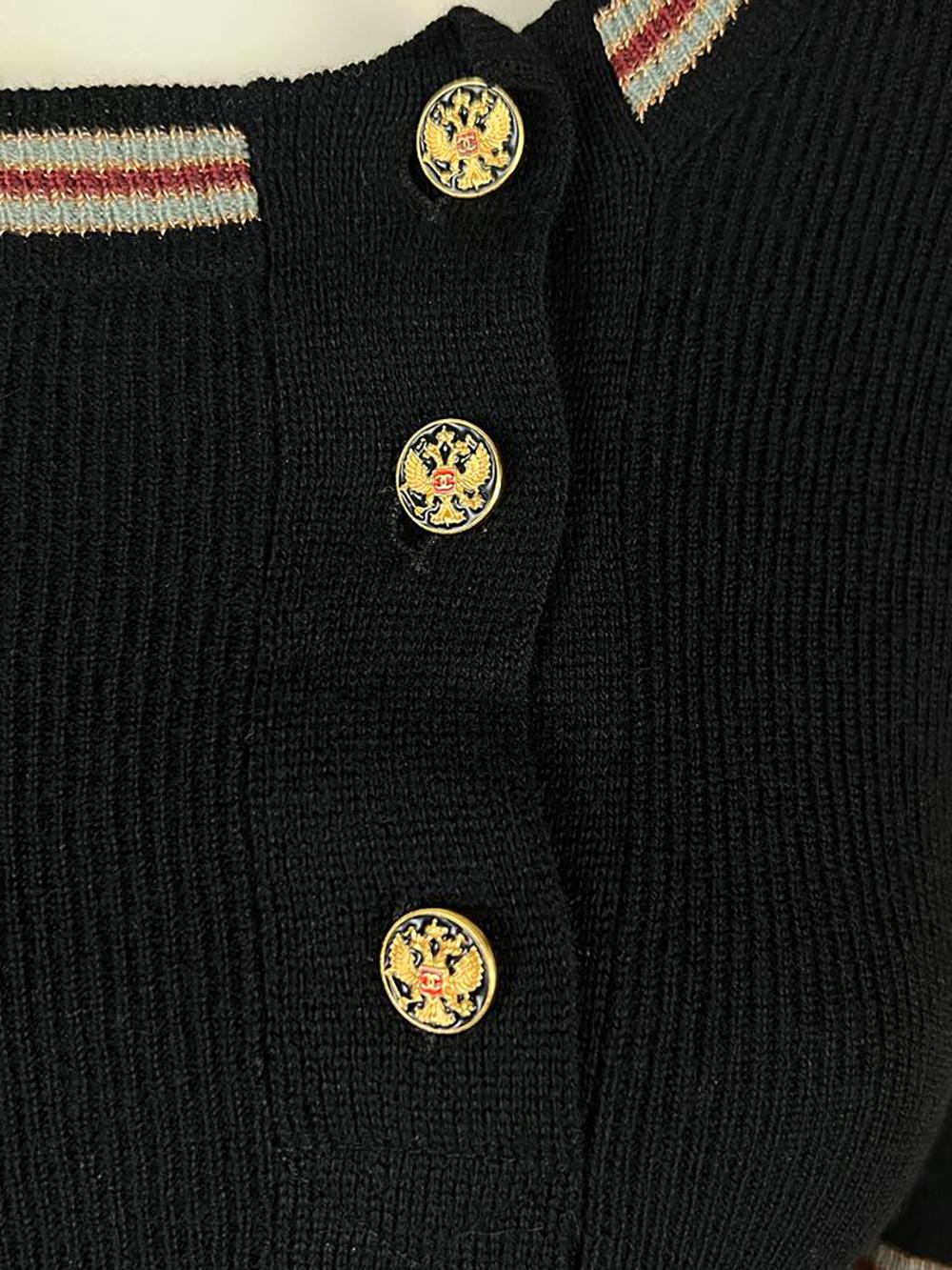Stunning Chanel ribber cashmere top with metallic trim. CC logo eagle buttons. Size mark 36 FR. Kept unworn.