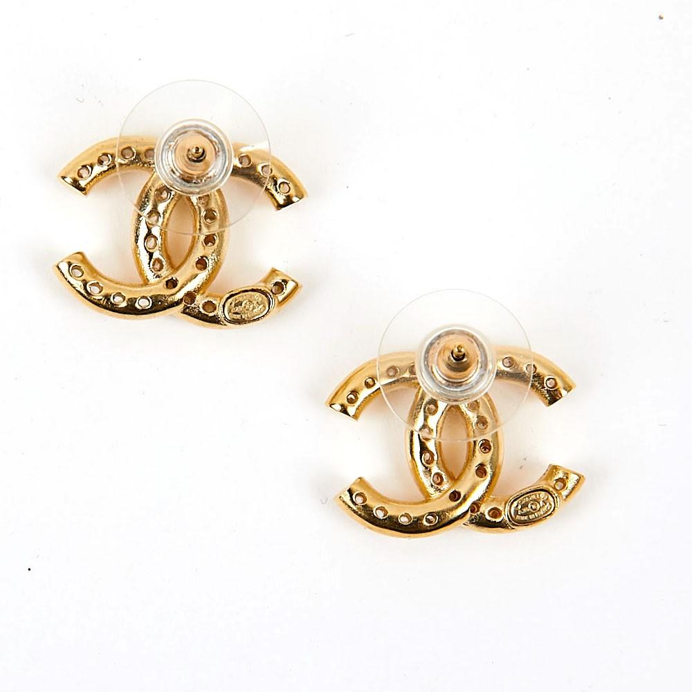 Never worn. CHANEL double C stud earrings in vintage gilded metal color set with white rhinestones.  Will light up any outfit.  
Dimensions: 1.7 cm x 2 cm
Will be delivered in a non original pouch. 