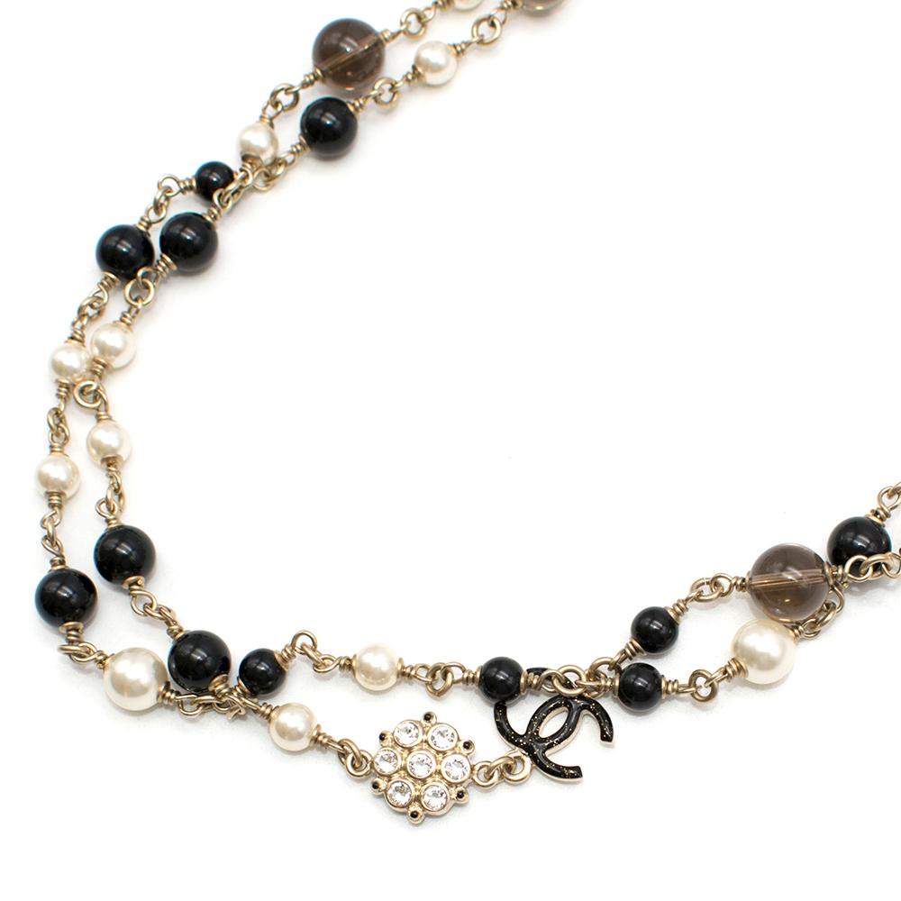 Chanel CC Faux Pearl and Black Bead Gold Long Necklace

- Chain link 
- Lobster clasp closure
- Gold tone metal styled with beads, faux pearls, and CC logos
- Faux crystal embellished details