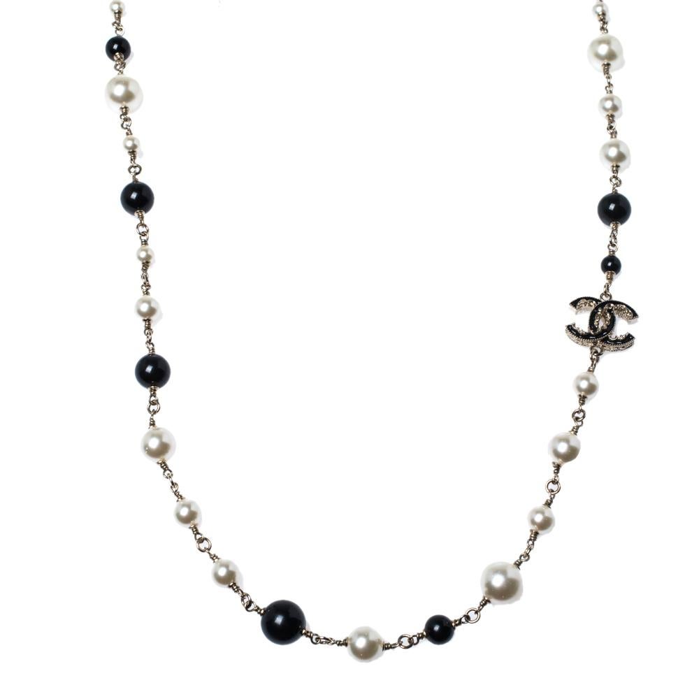 This Chanel piece is a creation to hold. It has been crafted out of gold-tone metal and styled with beads, faux pearls, and enameled CC logos. It is complete with a lobster clasp closure. This necklace will look best with all your off-shoulder