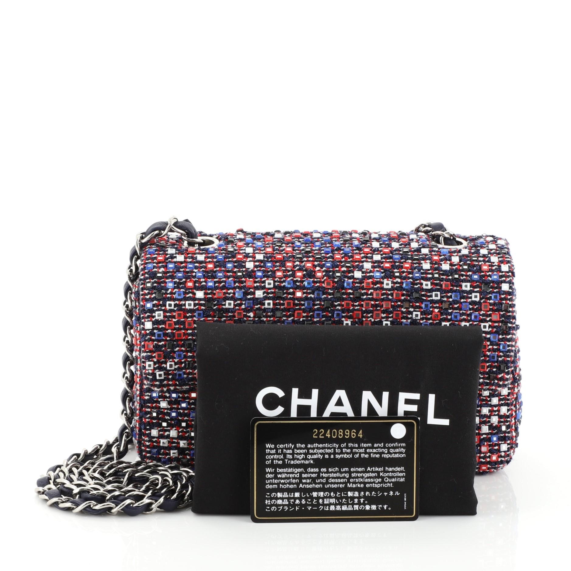 This Chanel CC Flap Bag Embellished Tweed Medium, crafted in multicolored tweed, features a woven in leather chain link strap and silver-tone hardware. Its CC turn-lock and zip closure opens to a blue leather interior. Hologram sticker reads: