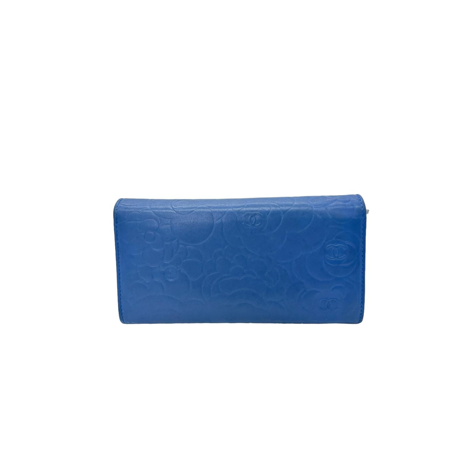 This Chanel Blue Camellia lambskin leather snap wallet is perfect if you are seeking something chic and luxurious to organize your essentials such as bills, credit cards and coins. It features Silver-tone hardware along with 12 card slots, two bill