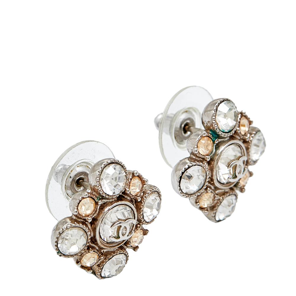 These stud earrings from Chanel are so pretty, you'll love wearing them! They are crafted from silver-tone metal and are beautifully embellished with crystals and the CC logo at the center. They are complete with pushbacks.