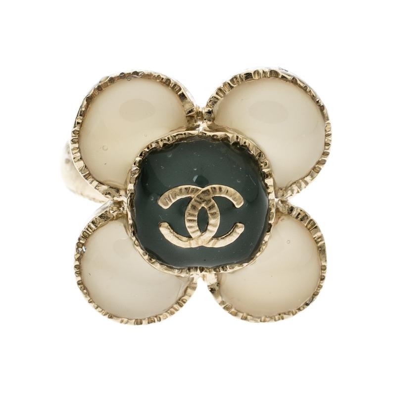 To give company to your french manicure nails and delicate fingers is this stunning ring from Chanel. It is crafted from gold-tone metal and features a flower motif, the petals of which are made of resin. The iconic CC logo sits at the heart of this