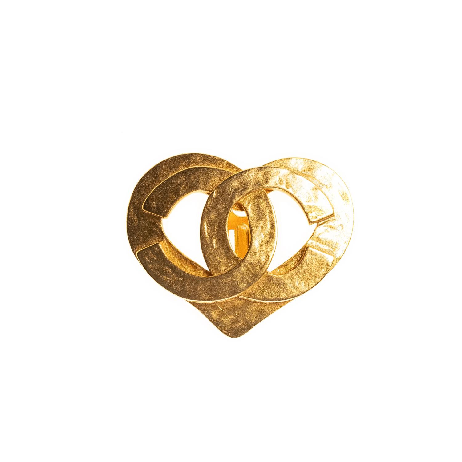 Chanel CC gold heart clip on earring, CC engraved on the front with clip at the back. Beautiful design, comes unopened in a transparent box. 

COLOR: Gold
MATERIAL: Metal
ITEM CODE: 95
MEASURES: H 1” x L 1.5”
COMES WITH: Chanel box.
CONDITION: Good