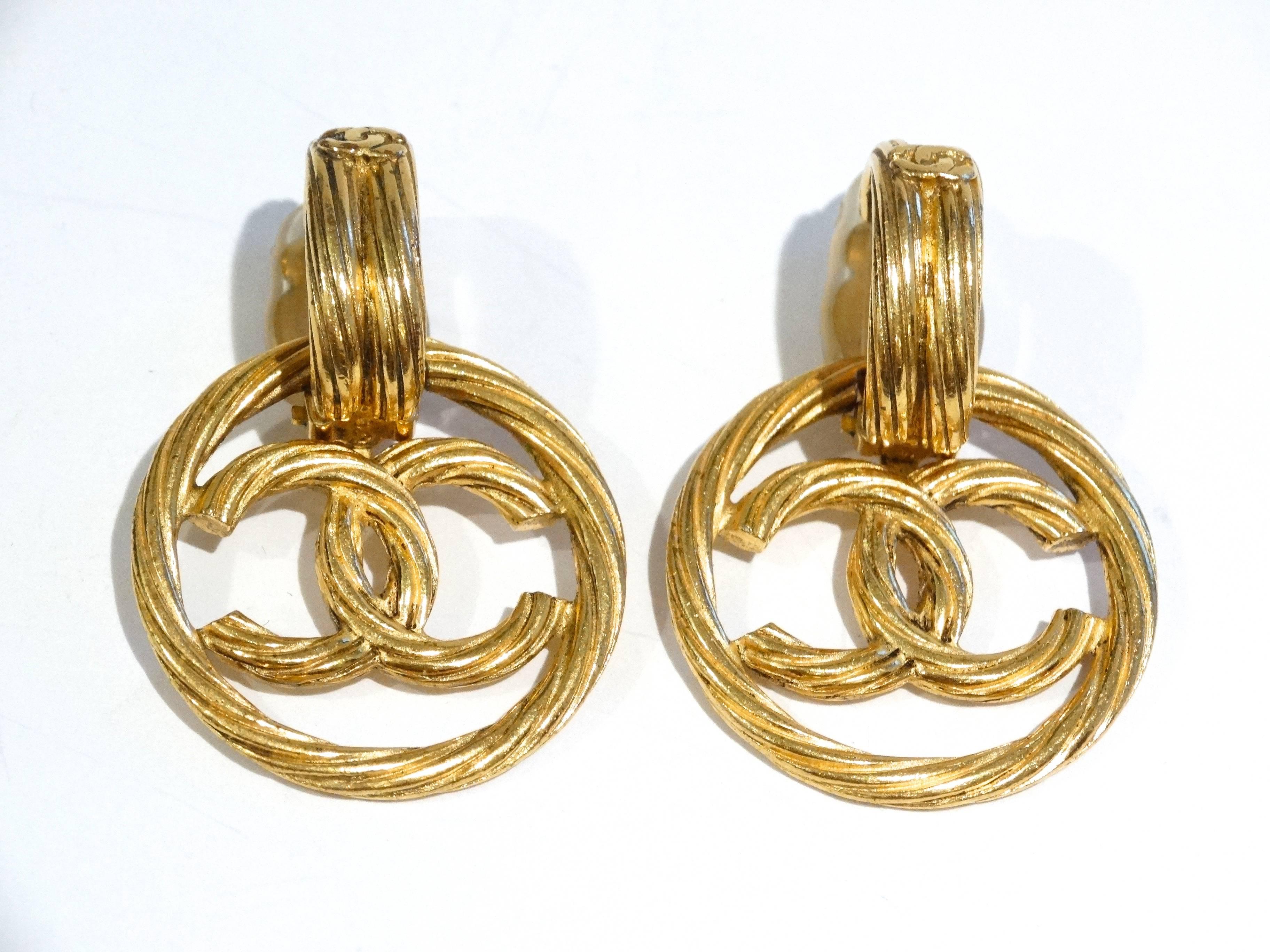 Classic Chanel '94 Gold Detachable Hoop Clip On Earrings. Top portion of earrings feature CC's with the bottom circle having large CC in the center of the hoop. Stamped 94 made in France. Number as well, style with your favorite Gucci hat and Dior