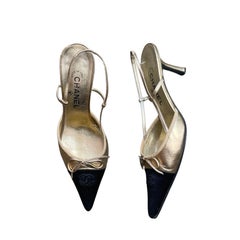 CHANEL ‘CC’ Gold Leather Black Satin Cap Toe Slingback Heels