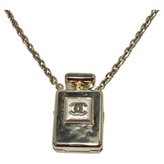 Chanel CC Gold Tone Perfume Bottle Locket Necklace