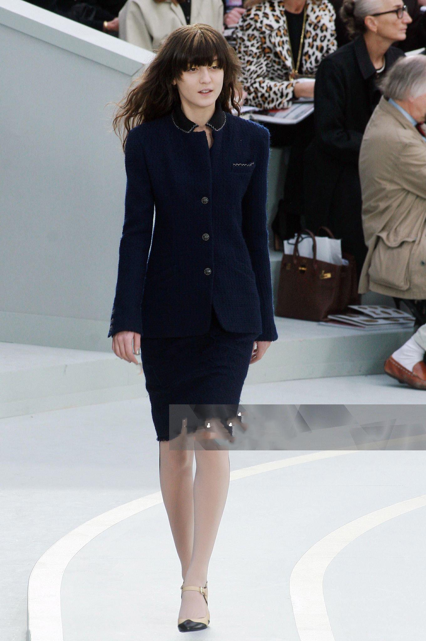Timeless Chanel navy tweed jacket with jewel CC buttons ~ statement piece beyond time and trends!
- contrast collar with stitching
- tonal silk lining with camellias, chain link at hem
Size mark 38 FR / Condition: never worn