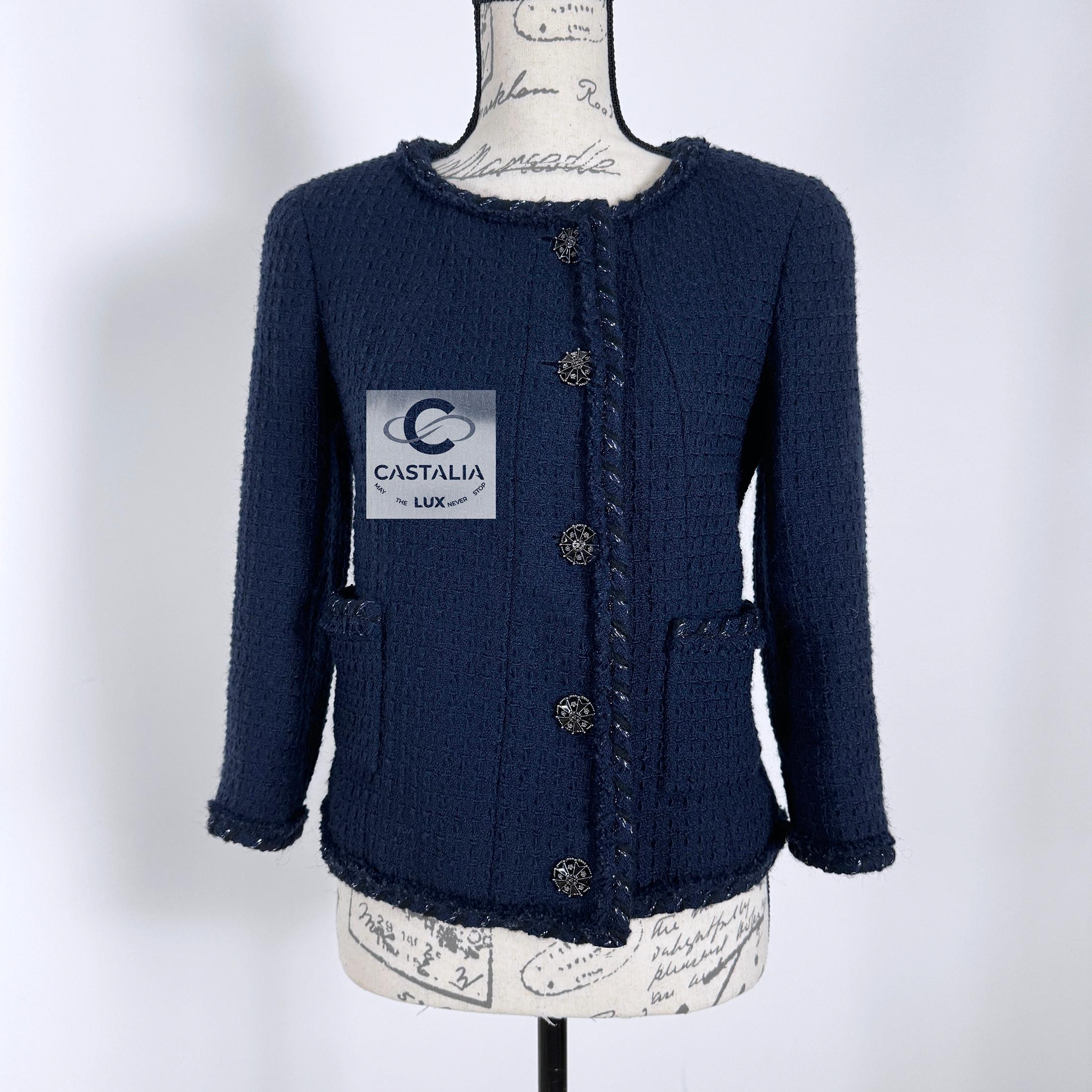 Timeless Chanel navy tweed jacket with CC jewel buttons !
- unmistakably Chanel silhouette
- signature braided metallic trim
- tonal silk lining with camellias, chain link at hem
Size mark 36 FR. Condition: pristine, kept unworn