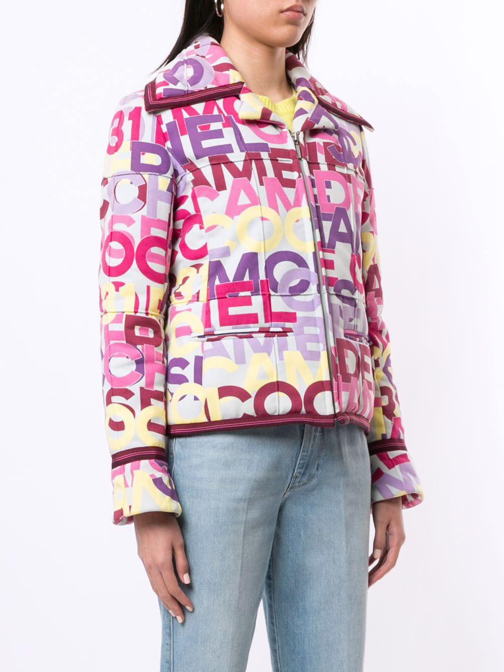 Collectors bright vintage puffer jacket Chanel with 31 RUE CAMBON and CHANEL lettering all over 
- beautiful pastel tones
- front fastening with logo zipper
Size mark 40 FR. Condition is pristine
