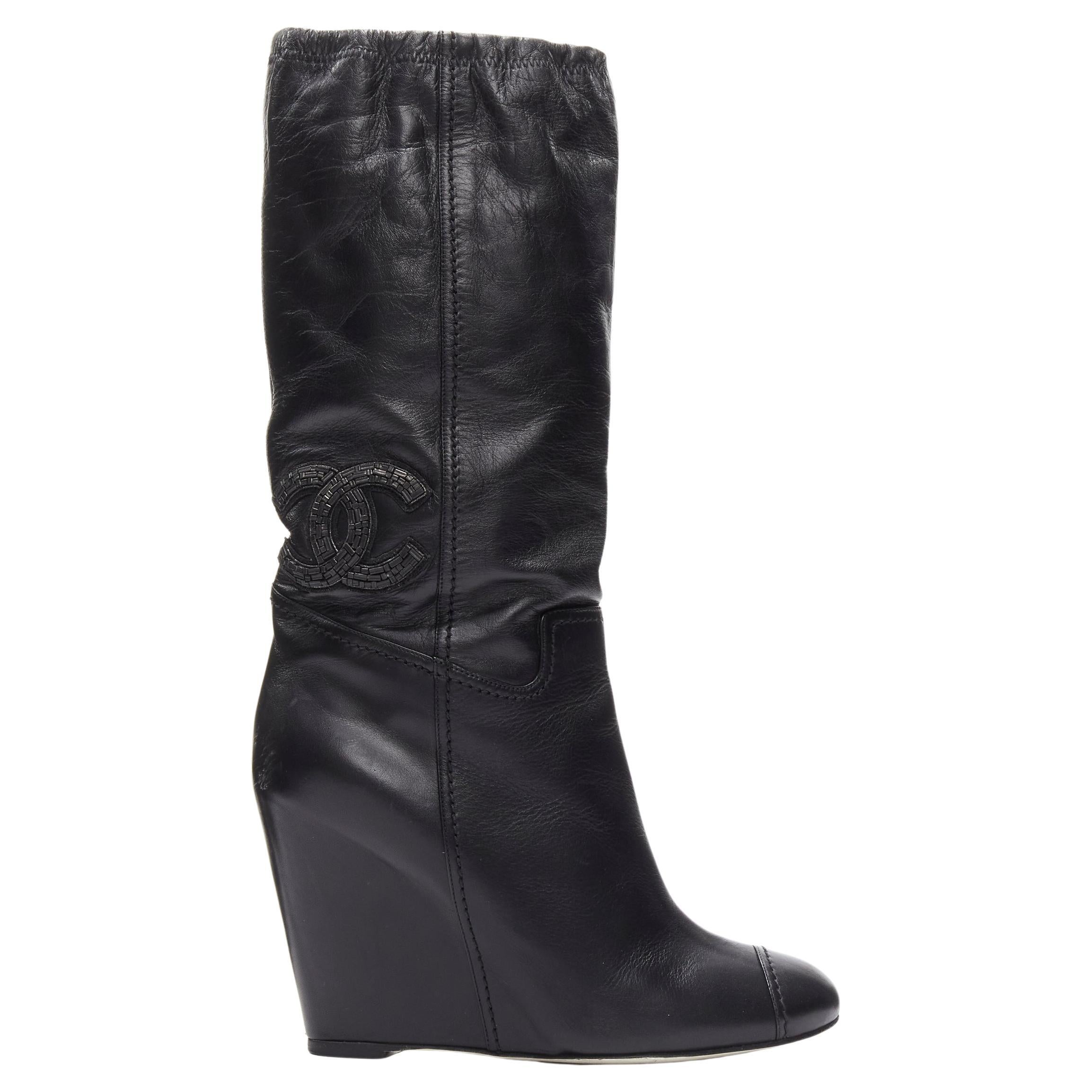CHANEL CC logo bead embellishment black leather wedge heeled boots EU38 For Sale