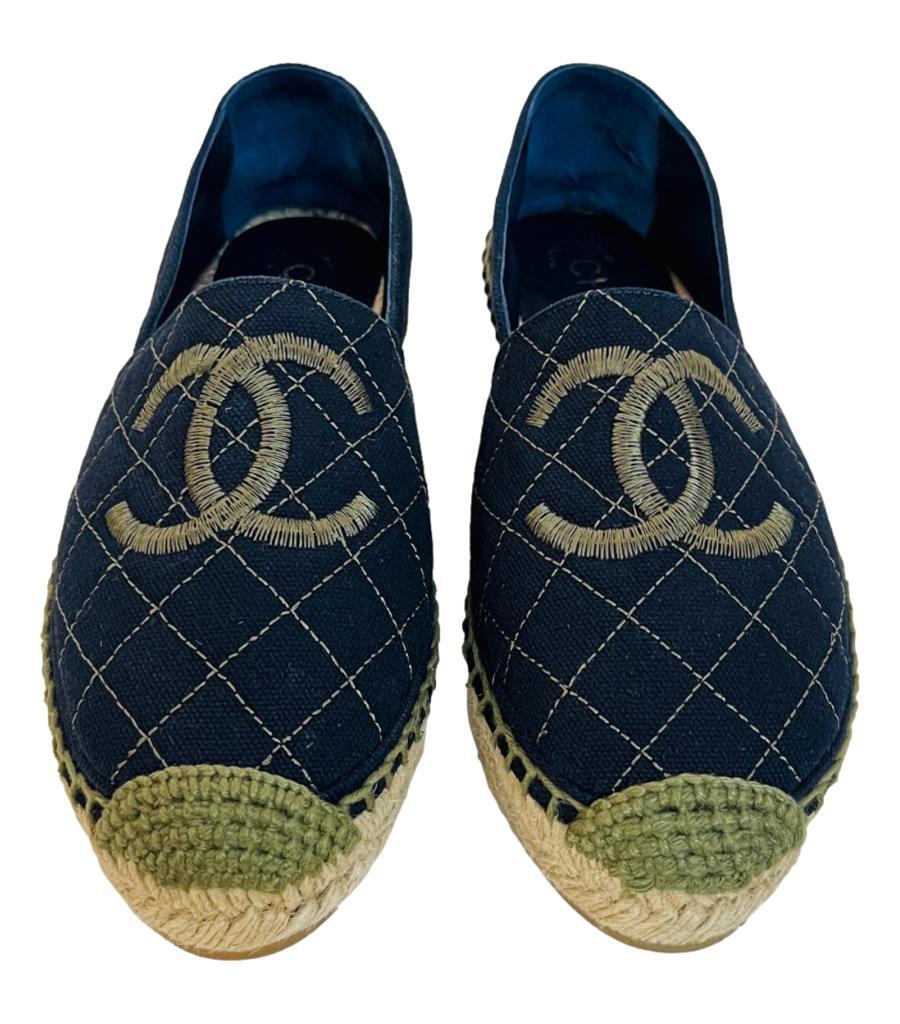 Chanel 'CC' Logo Canvas Espadrilles

Navy espadrilles with diamond quilted front and embroidered 'CC' logo to the centre.

Featuring light khaki toe and stitching detail; having braided raffia midsoles and rubber soles.

From Cruise 2018