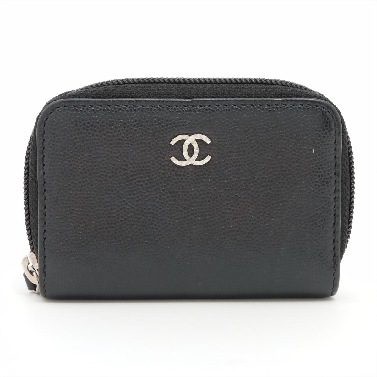 The Chanel CC Logo Caviarskin Coin Case in Black is a sophisticated and practical accessory that exemplifies Chanel's timeless elegance and meticulous craftsmanship. Meticulously crafted from caviarskin, a textured and durable leather associated