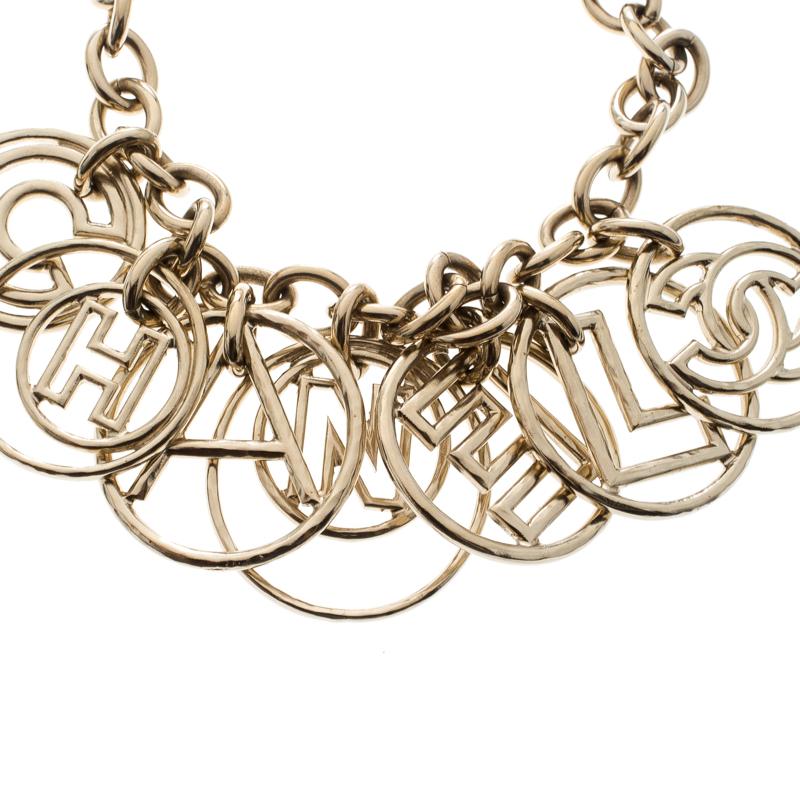 Perfect to adorn your delicate wrist and sure to garner you attention, this Chanel Bracelet is a must buy! It is crafted from gold-tone metal and features a chain link that is detailed with circular rings containing the 'CHANEL' letters within them