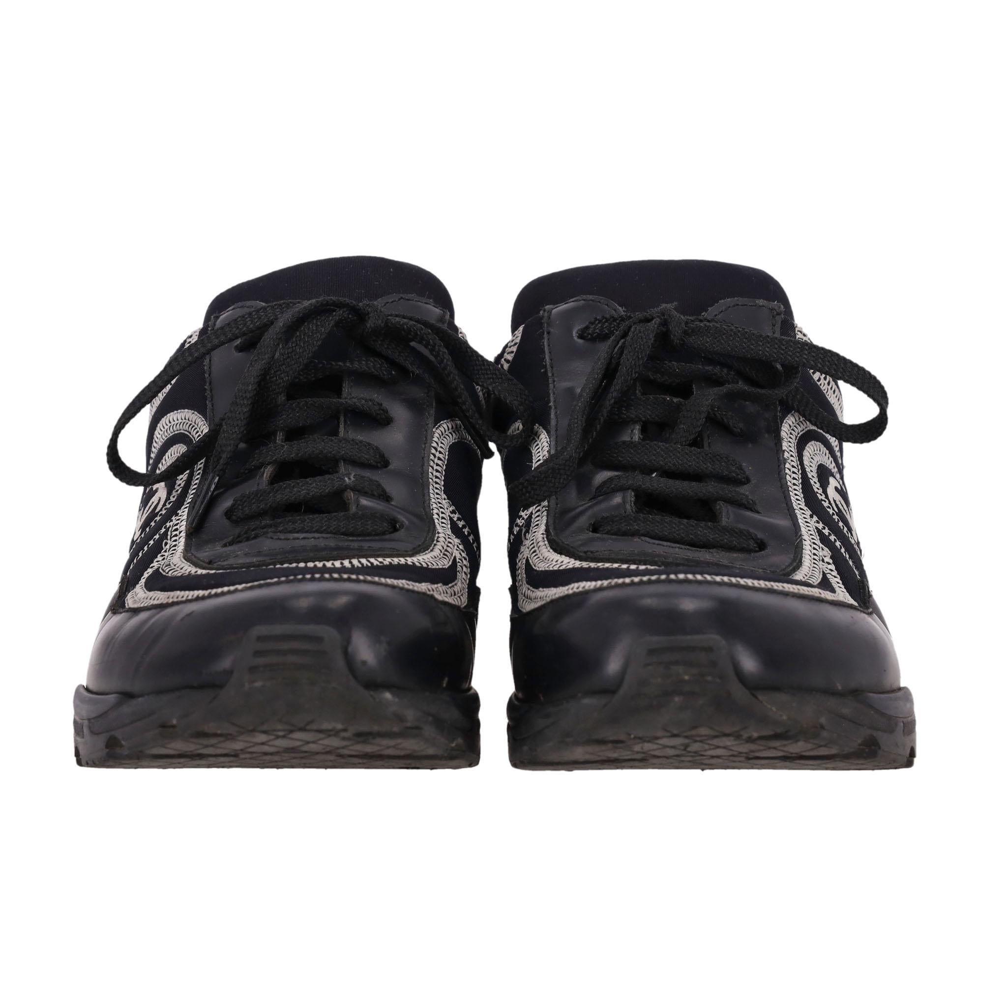 Rare Item - Chanel 'CC' Logo Embroidered Neoprene & Leather Sneakers

Black, low-top sneakers crafted of athletic, flexible neoprene with leather details.

Featuring contrast white stitching and signature 'CC' logo embroidery to the side.

Lace-up