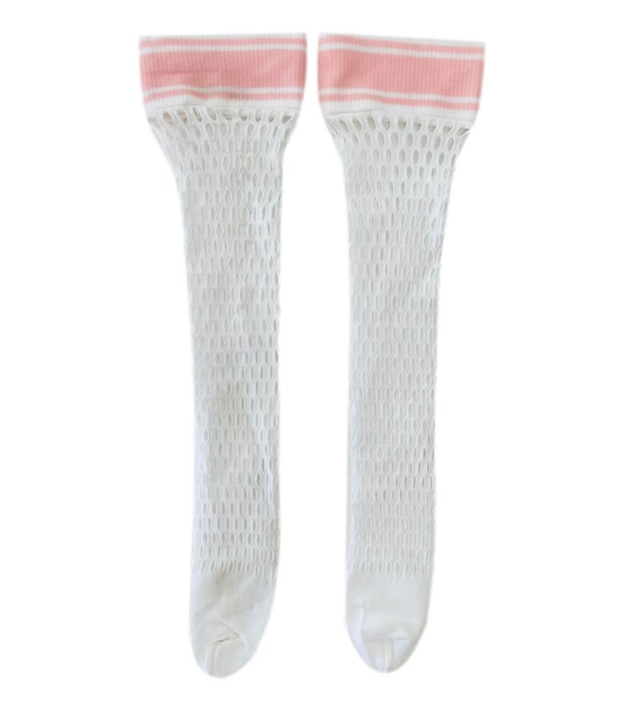 Chanel 'CC' Logo Fishnet Knee Socks

White fishnet socks designed with light pink cuffs detailed with 'CC'.

Size – One Size

Condition – Good (Minor marks and pilling to the fabric)

Composition – Not Known