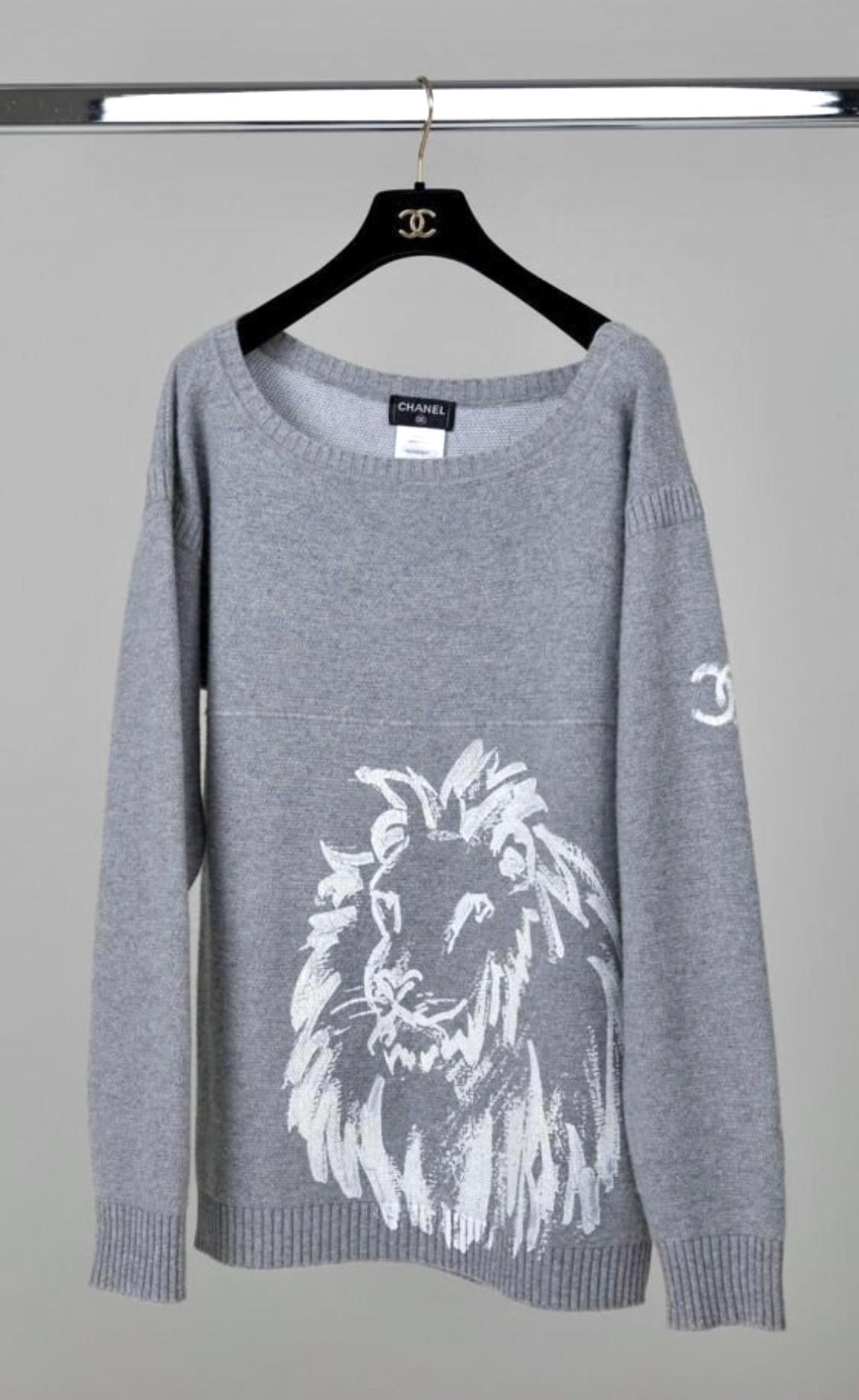 Cozy Chanel black softest cashmere jumper with CC Logo at sleeve and Lion's head at front.
 Size mark 44 FR. Condition: never worn.