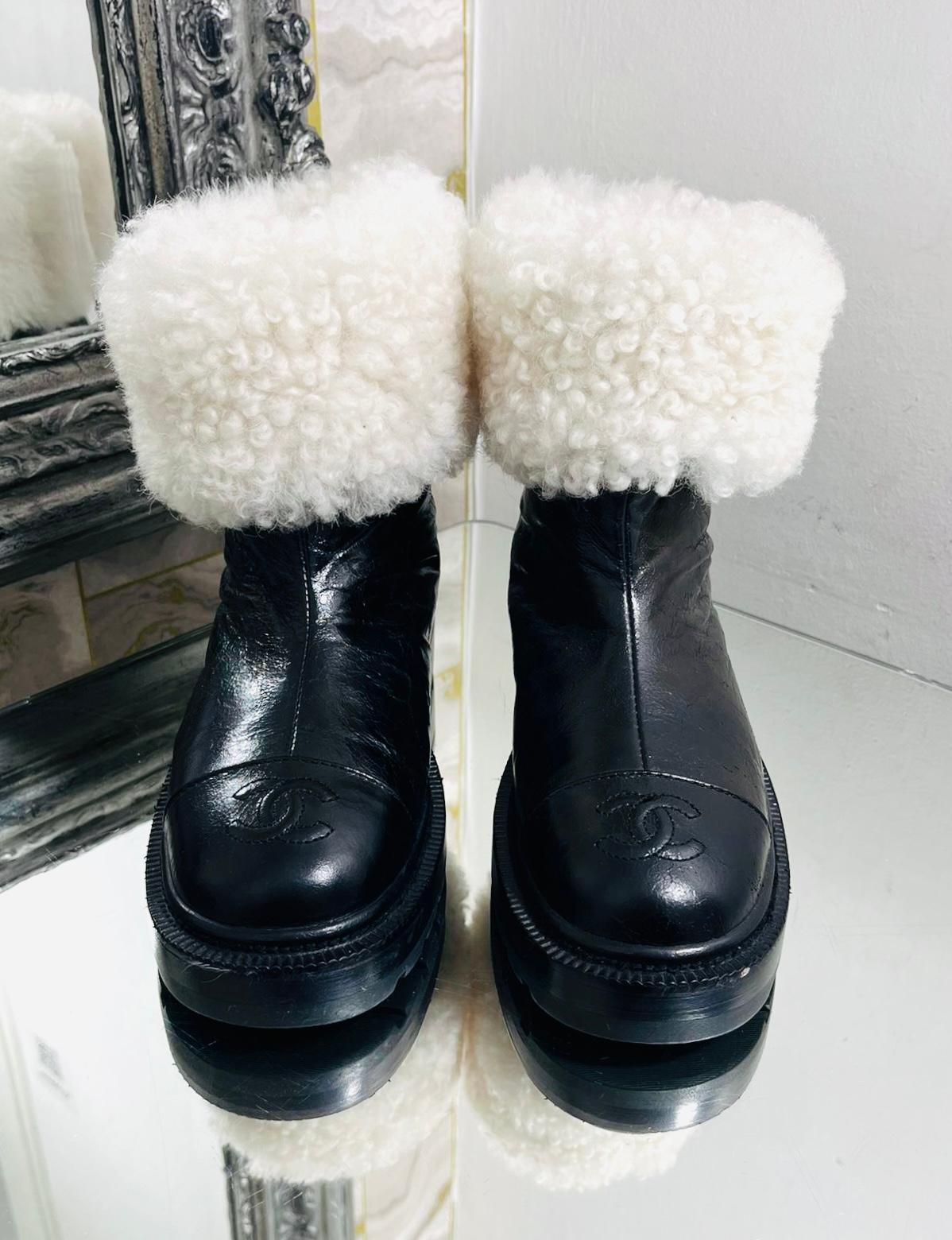 Sought after - Chanel 'CC' Logo Lambskin & Shearing Ankle Boots

Sold out worldwide - Black boots crafted from crinkled leather and detailed with 'CC' logo embroidery to the cap toe.

Featuring white shearling interior that can be worn rolled down