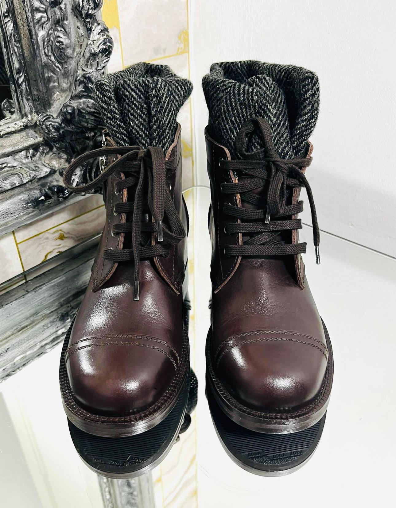 Chanel CC Logo Leather Ankle Boots

Deep brown, lace-up boots designed wit grey sock trim detailing.

Featuring 'CC' logo stitching  and zip fastening to the side.

Styled with round toe and short block heel, leather insoles.

Size – 37.5

Condition
