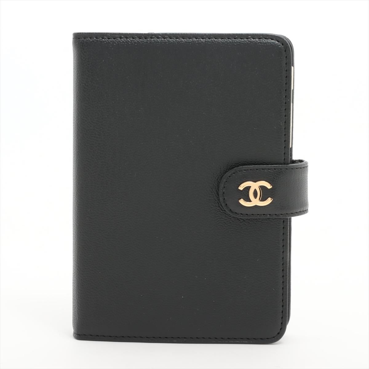 The Chanel CC Logo Leather Notebook Cover is a stylish and sophisticated accessory designed to elevate your stationery collection. Crafted from high-quality leather, the notebook cover features iconic Chanel CC logo on the snap lock button,
