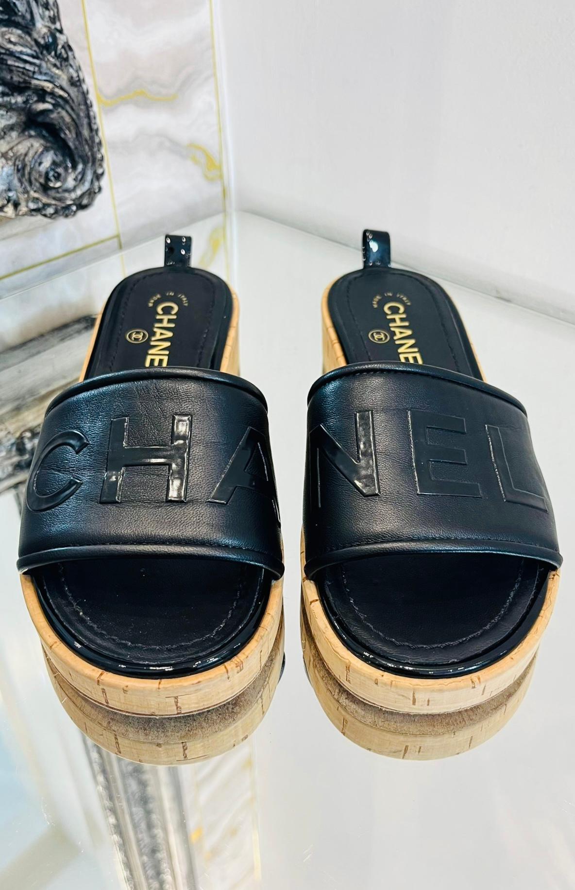 Chanel 'CC' Logo Leather Slides

Black leather uppers with stitched wording 'CHANEL'.

Cork style soles.

Size - 38

Condition - Very Good

Composition - Leather

Comes With - Dust Bags