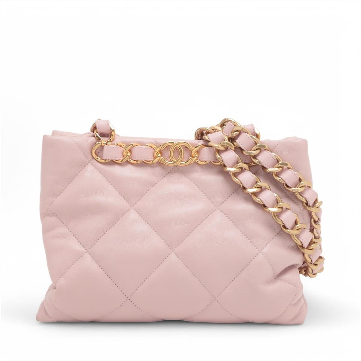 *will ship about 4/22

The Chanel CC Logo Matelassé Lambskin Chain Shopping Tote Bag in pink is a luxurious and spacious handbag that combines elegance with practicality. Made from soft, quilted lambskin leather, it features the iconic interlocking