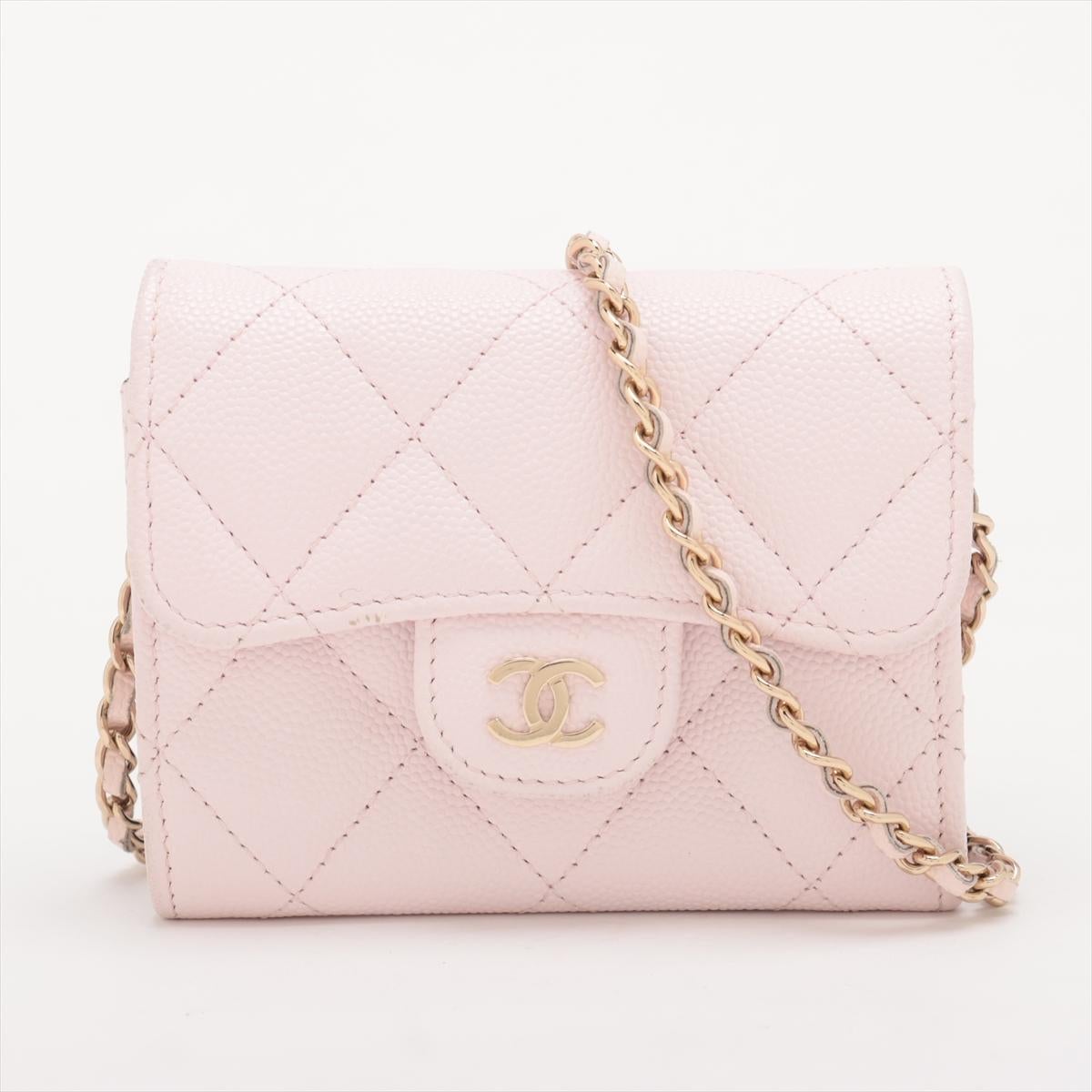 The Chanel CC Logo Mini Matelassé Caviar Skin Chain Shoulder Bag in Pink is a chic and compact accessory that combines timeless elegance with modern charm. Crafted from durable caviar leather, it features the signature quilted matelassé design,
